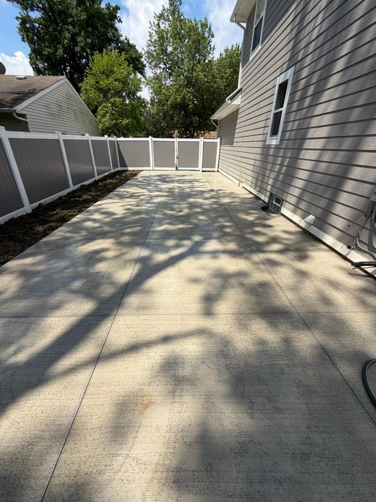 Project Concrete Patio and Privacy Fence Built for a Tight Backyard image