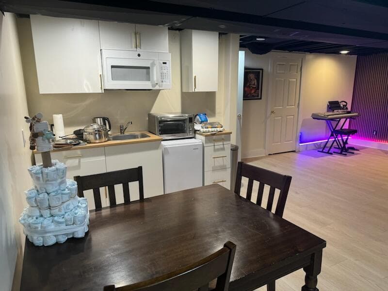 Gallery photos for Unfinished Basement Turned Full Living Space with Bedroom, Kitchen, and Movie Area: Image #1